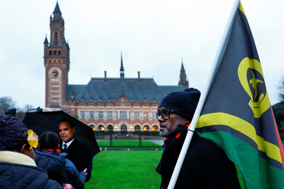 The Tuvalu delegation arrives for the International Court of Justice's public hearings in an advisory opinion case on countries' legal obligations to fight climate change in The Hague, Netherlands.