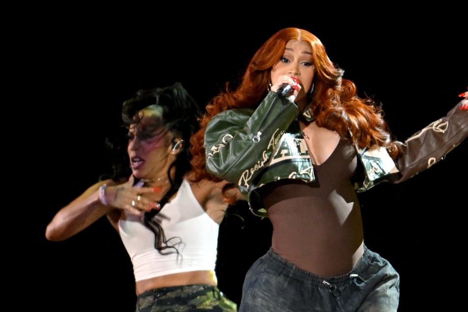 Cardi B seems to have added to her impressive tattoo collection with a series of radical neck and back piercings.