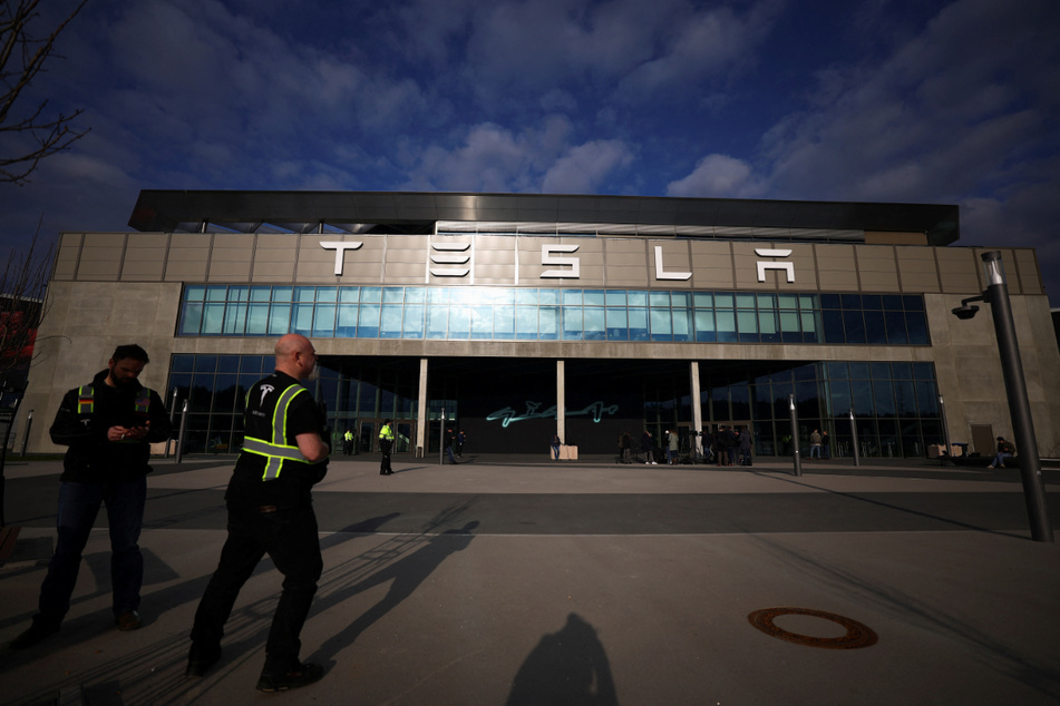 Tesla's giant factory in Germany was forced to shut down on Tuesday after activists set fire to high-voltage lines supplying its power.