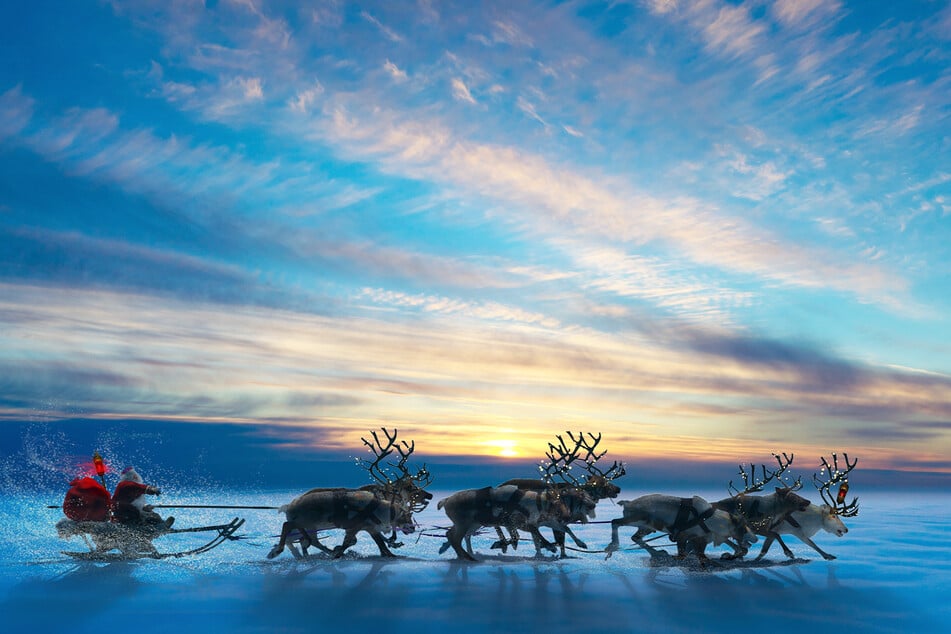 Santa Claus and his reindeer are on their way to hand out presents to well-behaved children (stock image).