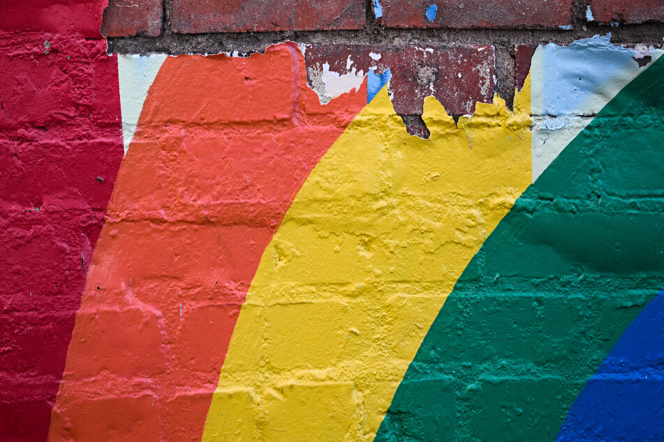 The paint of a rainbow, often a symbol of the LGBTQ+ community, peels off a brick wall in downtown Laramie, Wyoming, where nearly 25 years ago, gay college student Matthew Shepard was brutally murdered, shaking the world.
