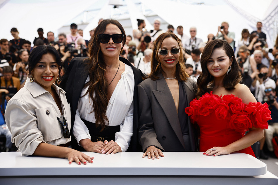 From l. to r.: Cast members Adriana Paz, Karla Sofia Gascon, Zoe Saldana, and Selena Gomez pose during a photocall for Emilia Perez in competition at the 77th Cannes Film Festival.