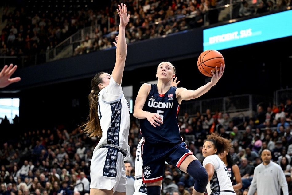 Paige Bueckers' (r.) decision to return to UConn next season significantly boosts the Huskies' lineup for next year.
