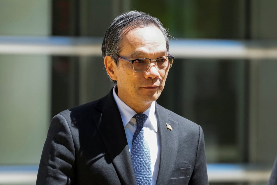 Lu Jianwang, a US citizen charged with conspiring to act as an agent of the Chinese government by helping set up a Chinese "secret police station," exits Brooklyn Federal court during his trial in New York City on May 12, 2026.