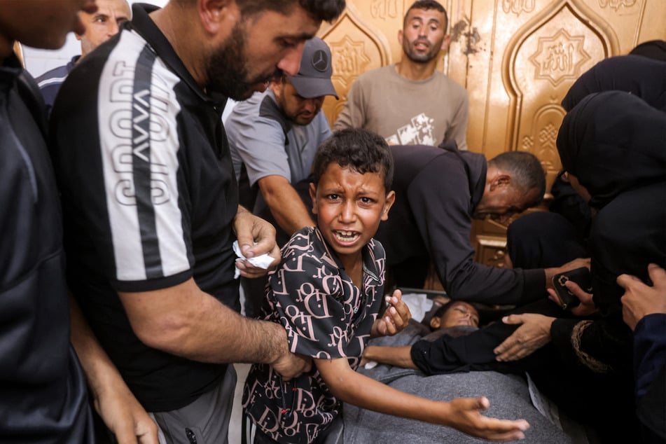 A Palestinian boy mourns his 12-year-old brother after he was killed by Israel, at Nasser Medical Complex in Khan Younis in the southern Gaza Strip on June 24, 2026.