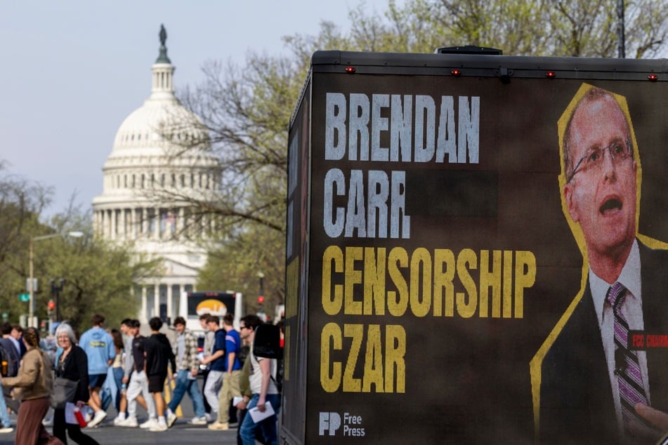 A billboard truck drives in front of the US Capitol building accusing Federal Communications Commission Chair Brendan Carr of censorship.