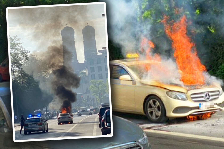 München: Mitten in München: Taxi fängt während der Fahrt Feuer