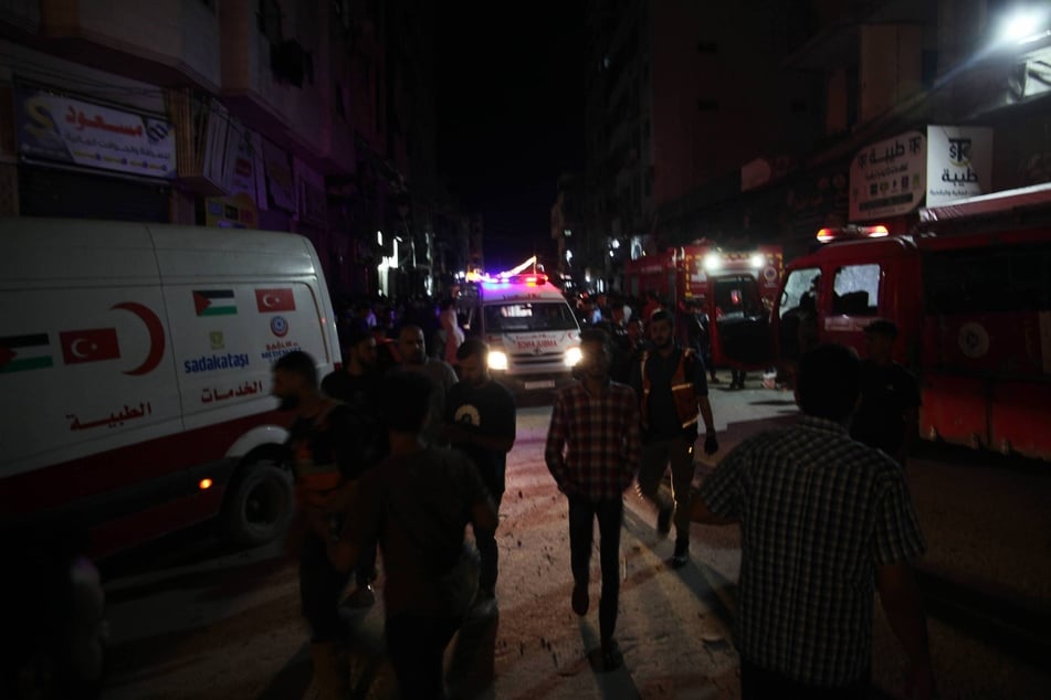 Emergency teams arrived at the scene following Israeli airstrikes on a residential building in the Rimal area of Gaza City on May 26, 2026.