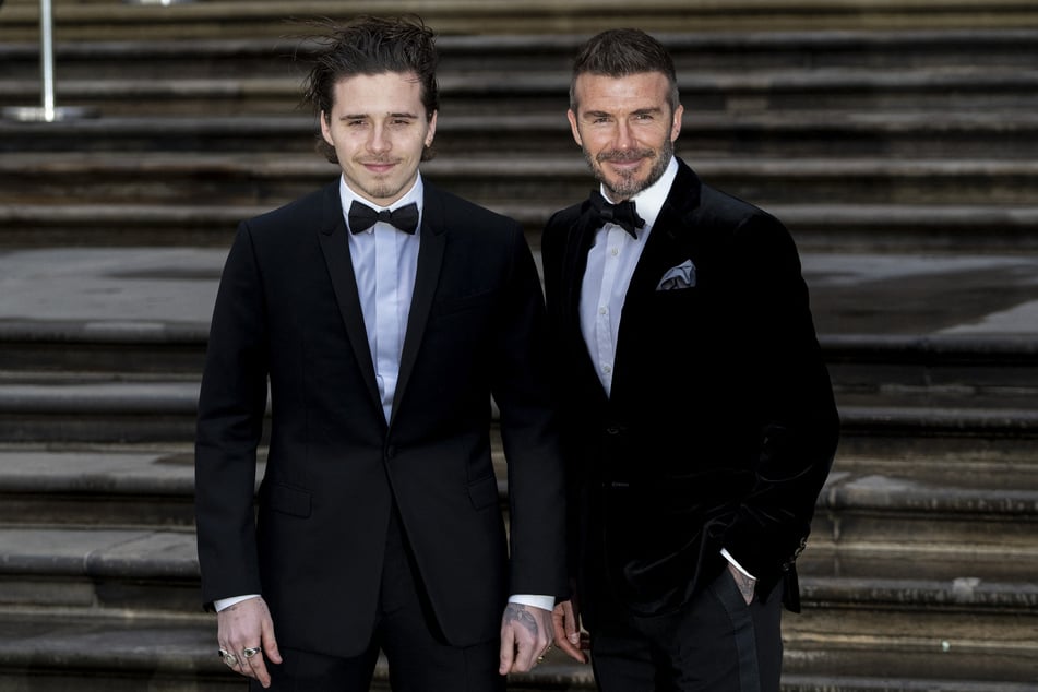 David Beckham's (r.) oldest son Brooklyn Beckham (l) didn't attend his father's 50th birthday dinner amid rumors that there's a rift in the family.