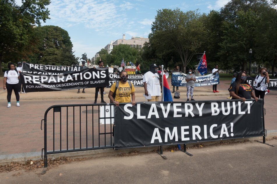 Activists rally outside the White House in 2021 demanding President Joe Biden take action on reparations for Black Americans.