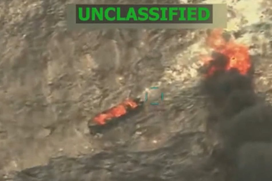 This screen grab from a video posted by President Donald Trump on his Truth Social account on September 15, 2025, shows US military forces conducting a strike on a boat in the Caribbean.