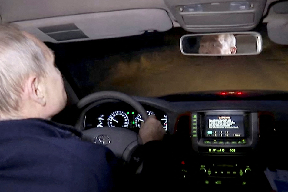 Russian state television showed Putin at the wheel of a car driving through the eastern city at night.