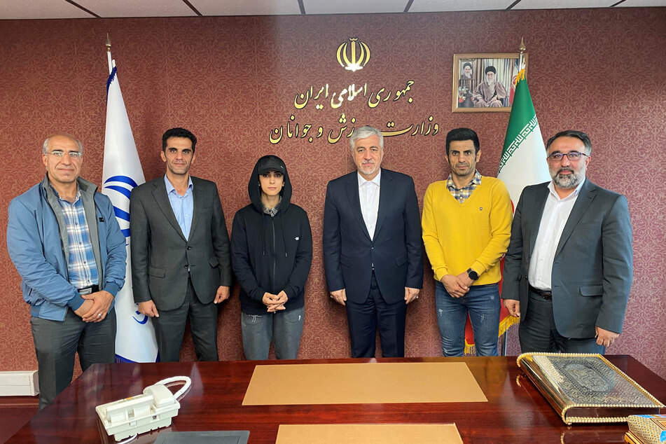 Iran's Minister of Youth Affairs and Sports Hamid Sajjadi meets with Iranian climber Elnaz Rekabi in Tehran, Iran, on October 19, 2022.