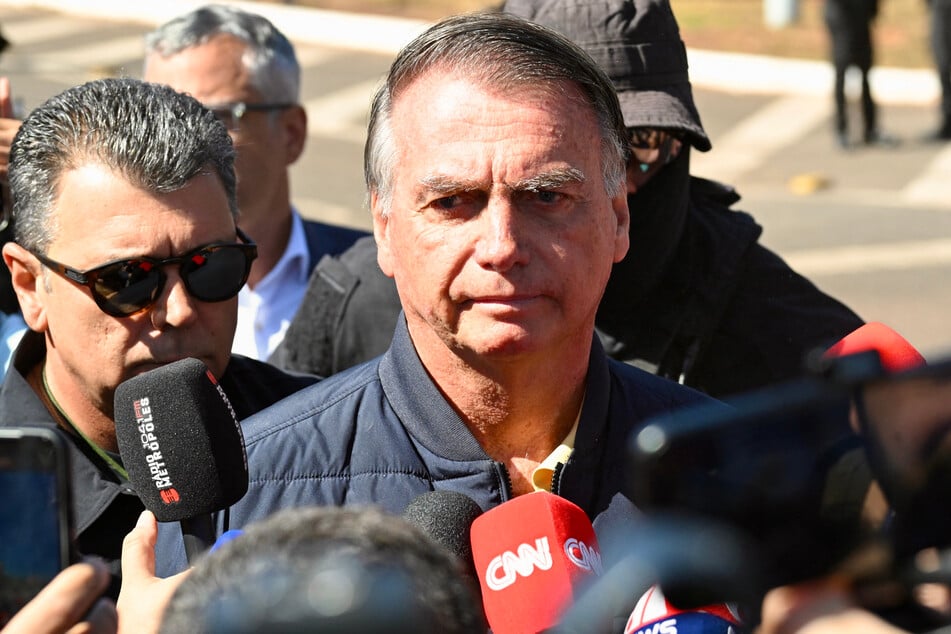 Brazilian police on Friday raided far-right ex-leader Jair Bolsonaro's home after a judge curtailed his freedom while he stands trial on coup charges.