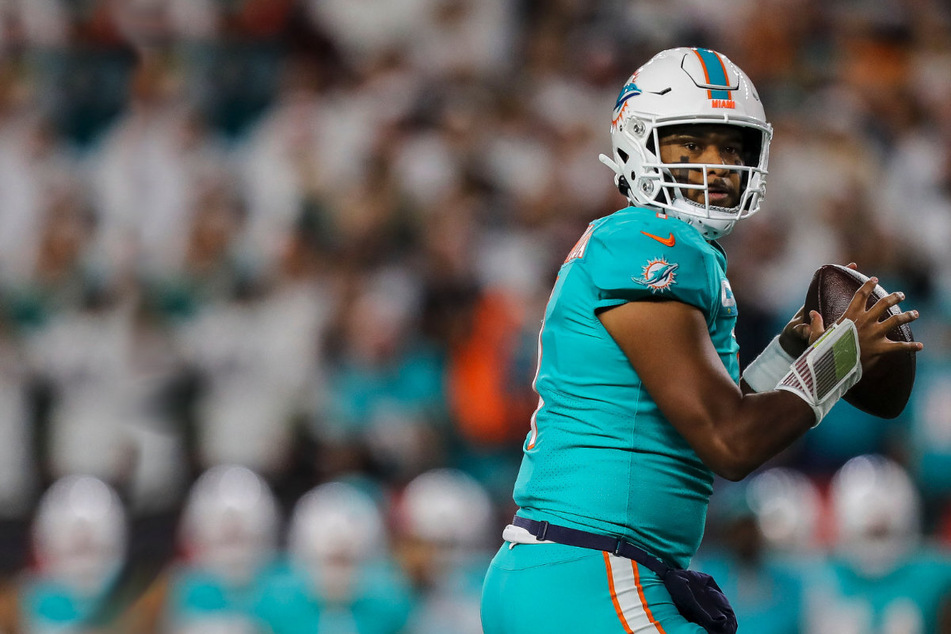 Dolphins QB Tua Tagovailoa preparing to throw the ball during a game against the Bengals.