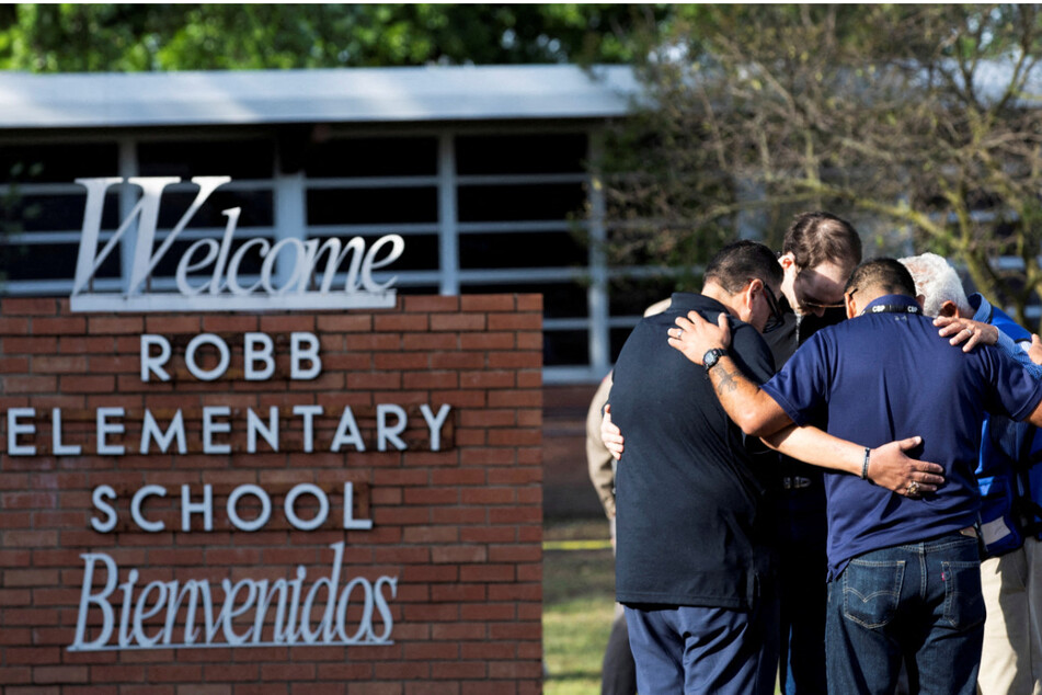 Mourners gather outside Ross Elementary School after Tuesday's mass shooting in Uvalde, Texas.