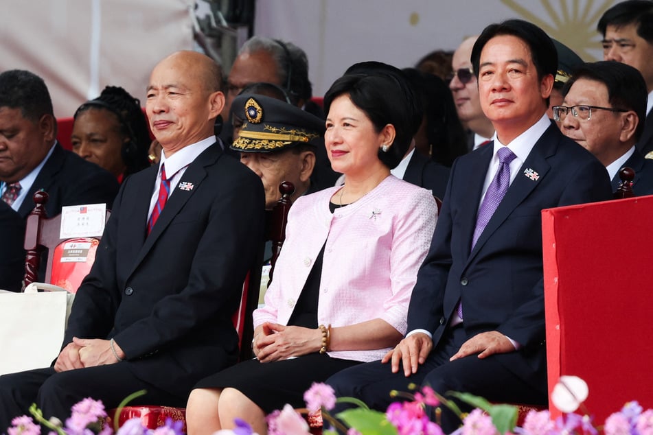 Taiwan's President Lai Ching-Te (r.) vowed to resist Chinese "annexation" in a speech on Thursday.