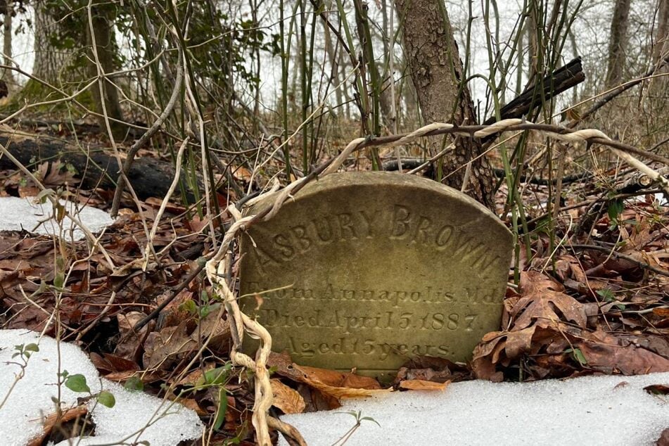 An abandoned 19th-century grave is pictured on the grounds of the House of Reformation for Colored Children in Cheltenham, Maryland, on February 17, 2026.