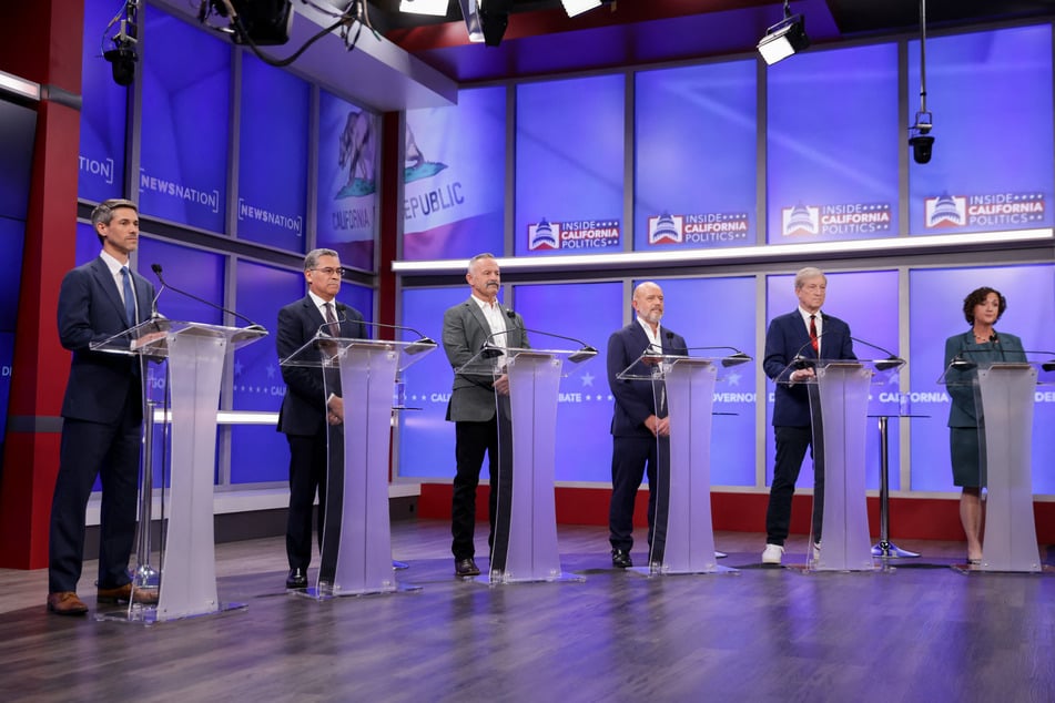 From l. to r.: Matt Mahan, Xavier Becerra, Chad Bianco, Steve Hilton, Tom Steyer, and Katie Porter participate in a California gubernatorial debate at the studios of KRON4 in San Francisco on April 22, 2026.