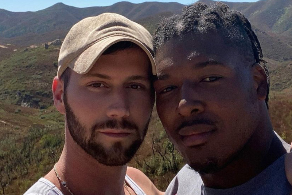 29-year-old NFL player Ryan Russell (r.) poses with his boyfriend Corey O'Brien, a professional dancer.