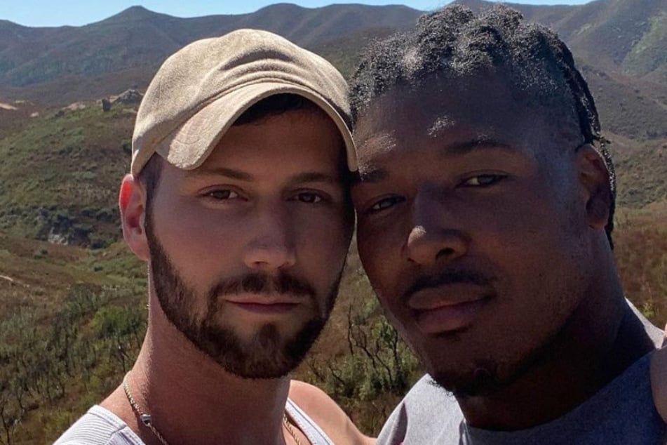 29-year-old NFL player Ryan Russell (r.) poses with his boyfriend Corey O'Brien, a professional dancer.