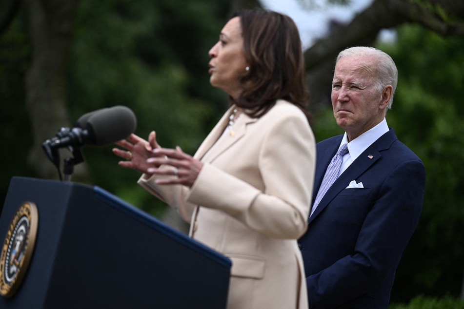 President Joe Biden (r.) looks on as US Vice President Kamala Harris (l.) delivers remarks during National Small Business Week in the Rose Garden of the White House in Washington, DC, on May 1, 2023.