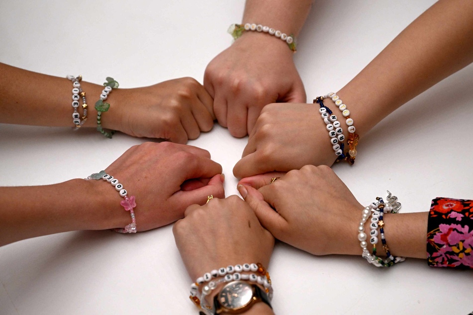 The Melbourne University Swifties Society members displayed their bracelets as Taylor Swift fans gathered for a "fanposium" in Melbourne earlier this week ahead of her Australia shows.