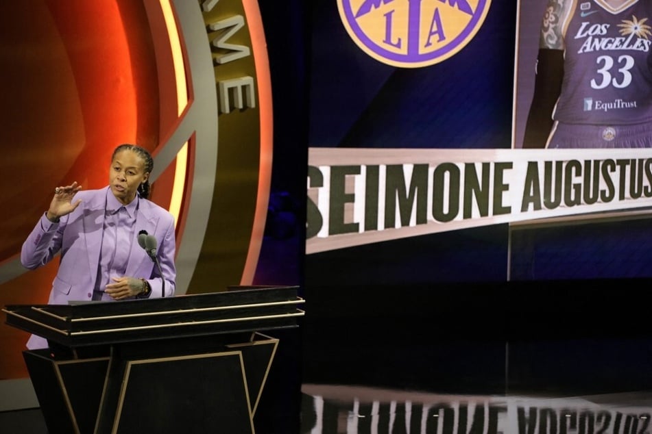 WNBA star Seimone Augustus performs a poem she wrote during the 2024 Naismith Basketball Hall of Fame Induction at Symphony Hall in Springfield, Massachusetts.