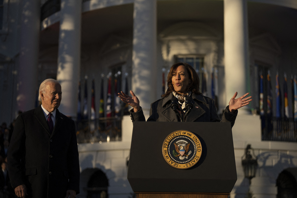 Vice President Kamala Harris (r) and President Joe Biden addressed the crowd before the president signed the historic bill into law.