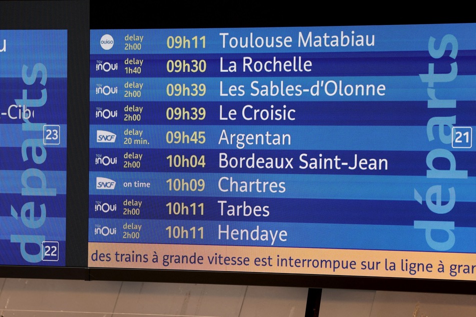 A departure board announces delays of train services at the Gare Montparnasse train station in Paris on Friday.