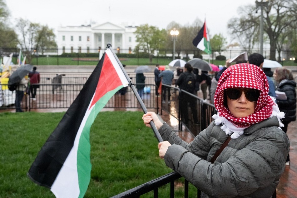 Protesters rally for Palestinian liberation outside the White House in Washington DC.