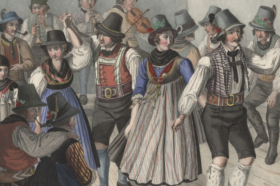 Eine Lithografie aus der Zeit um 1825 mit dem Titel "Kirchweih-Tanz in der Umgegend von Tegernsee". Bei einigen Tänzern schauen die Haare deutlich unter den Hüten hervor.
