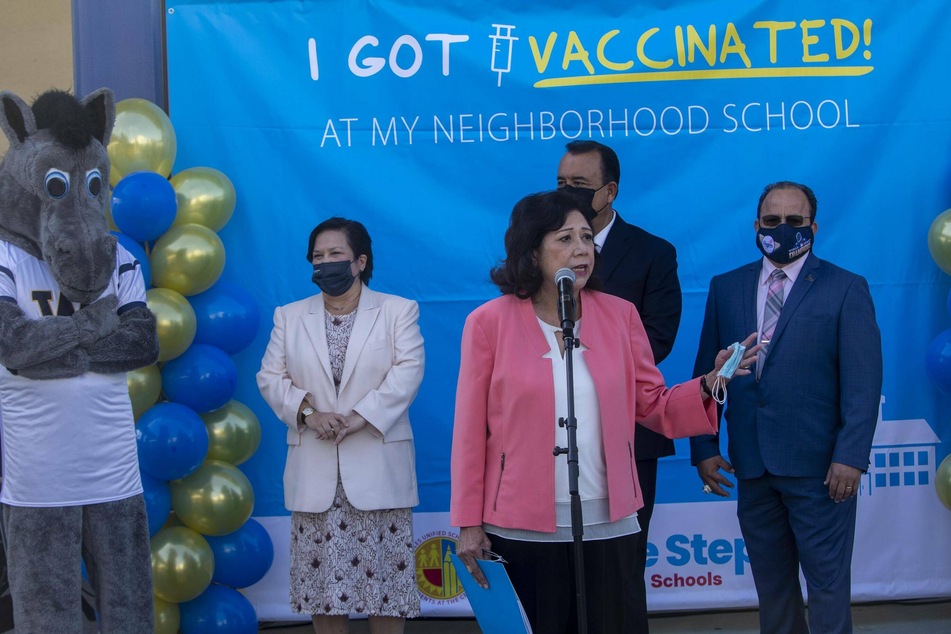 LA County Supervisor Hilda Solis spoke at a mobile vaccination clinic at a LA high school, after The Board of Education approved a mandate that all public school children 12 and older must be fully vaccinated against Covid-19 by January. It became the first major US school district to do so.