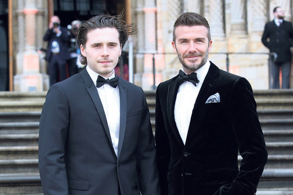 David Beckham (46, r.) schenkte seinem Sohn Brooklyn (23) einen E-Jaguar zur Hochzeit.