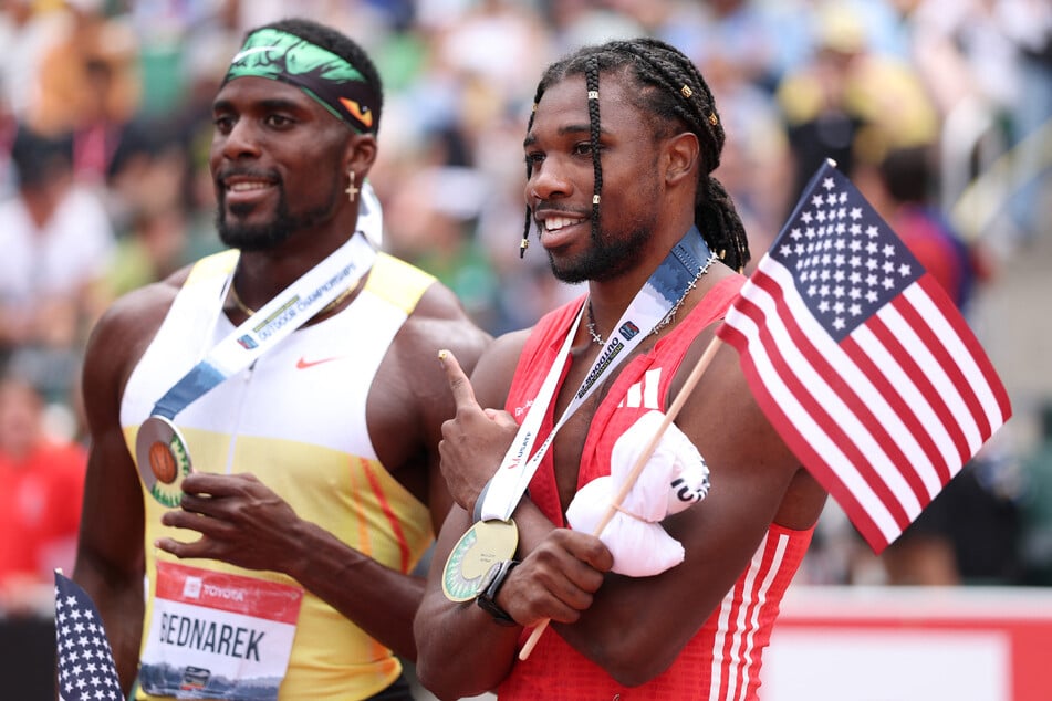 Silver medalist Kenny Bednarek (l.) and gold medalist Noah Lyles pose after the Xfinity Men's 200m final during the 2025 USATF Outdoor Championships at Hayward Field on August 3, 2025, in Eugene, Oregon.