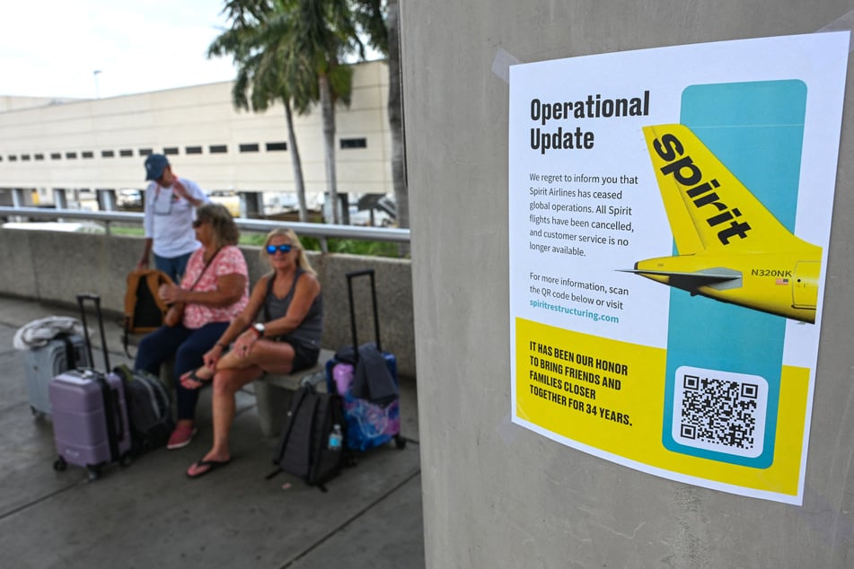 A Spirit Airlines message for customers is seen on a pamphlet after the company ceased global operations at Fort Lauderdale-Hollywood International Airport on May 2, 2026.