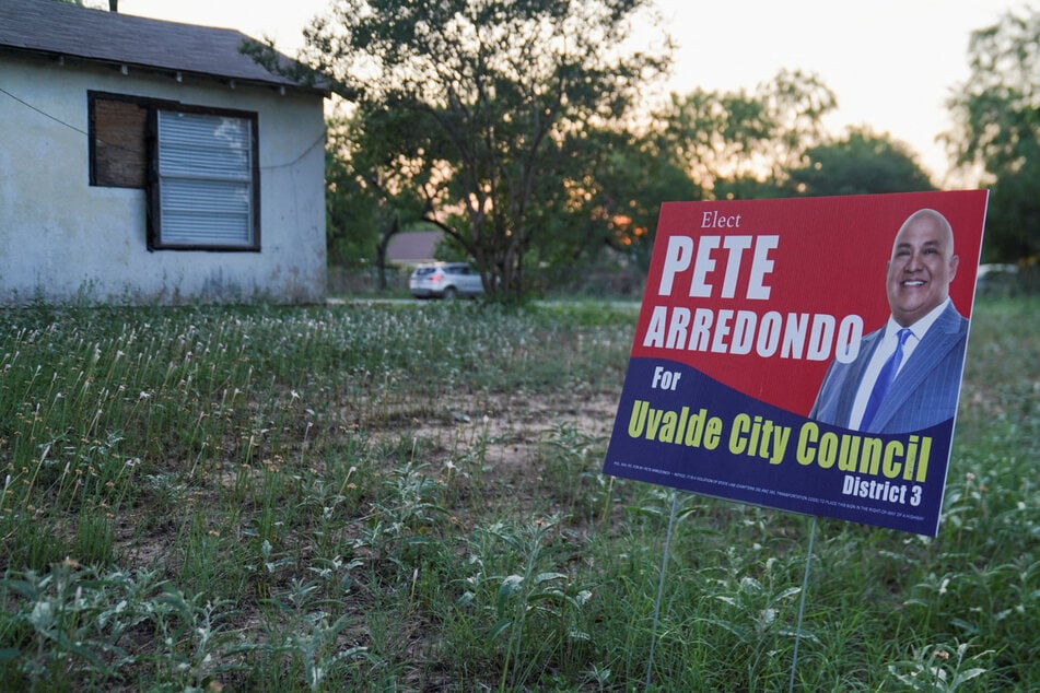 A political sign for Pete Arredondo, the Uvalde police chief, is placed in a yard in Uvalde, Texas.