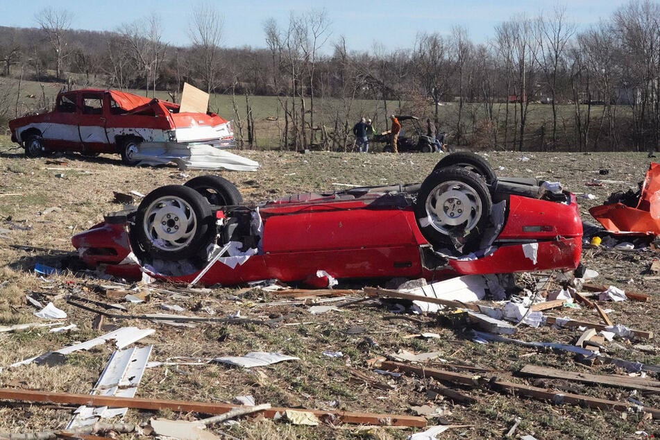 A corvette that was thrown fifty yards from its garage in Missouri was seen in the aftermath of the tornadoes.