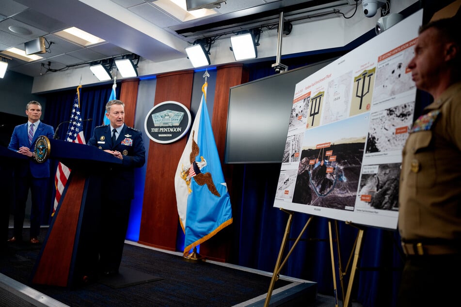 Chairman of the Joint Chiefs of Staff Dan Caine (second from l.), accompanied by Defense Secretary Pete Hegseth (l.), speaks during a news conference at the Pentagon after June airstrikes on Iranian nuclear facilities.