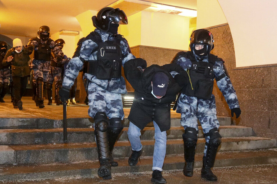 Police officers detain a participant in an unauthorized rally in support of Alexei Navalny in central Moscow.