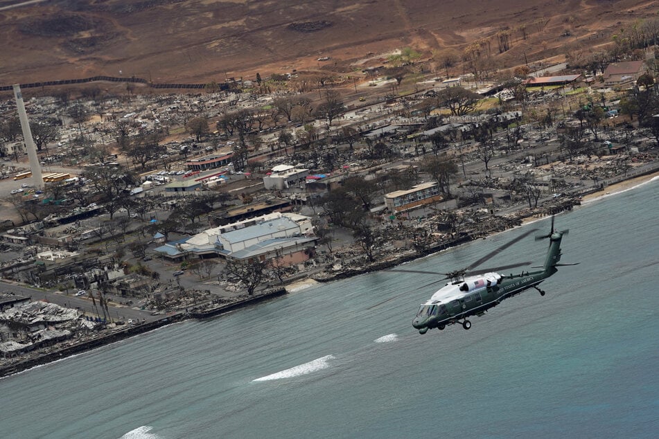 President Joe Biden, aboard Marine One, inspects the fire-ravaged town of Lahaina on August 21, 2023.