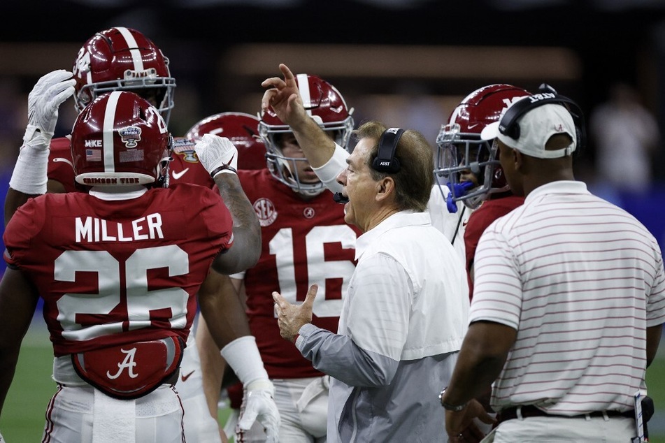 Many fans disagreed with Nick Saban's (c.) latest College Football Playoff statements, including former NFL quarterback football analyst Danny Kanell.