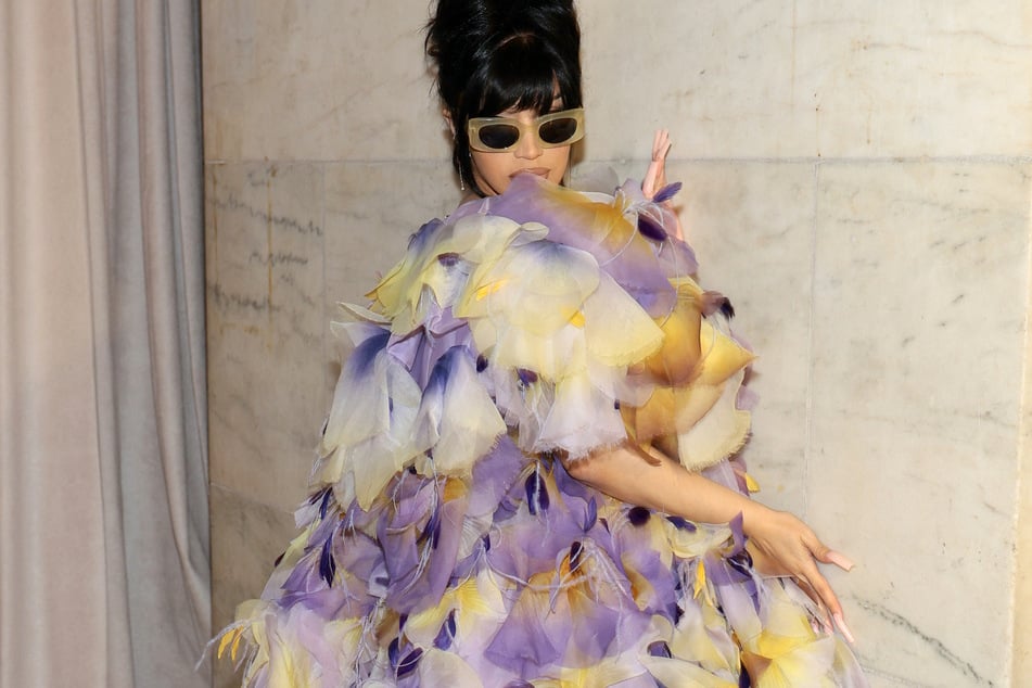 Cardi B flaunted her colorful feathers at the Marc Jacobs' Fall Fashion Show in NYC.