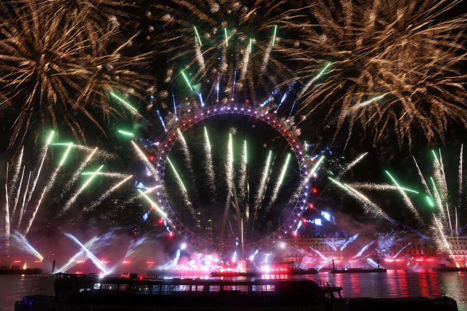 Fireworks are seen exploding around the London Eye during New Year's celebrations in London.