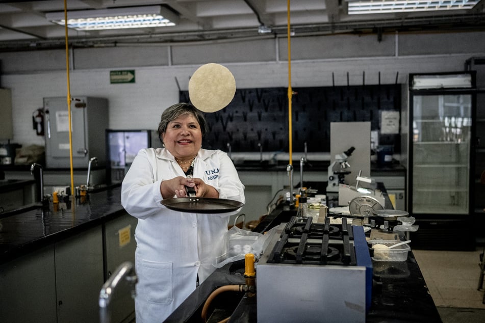 Dr. Raquel Gomez Pliego flips a tortilla at the Industrial Microbiology laboratory of the National Autonomous University of Mexico.
