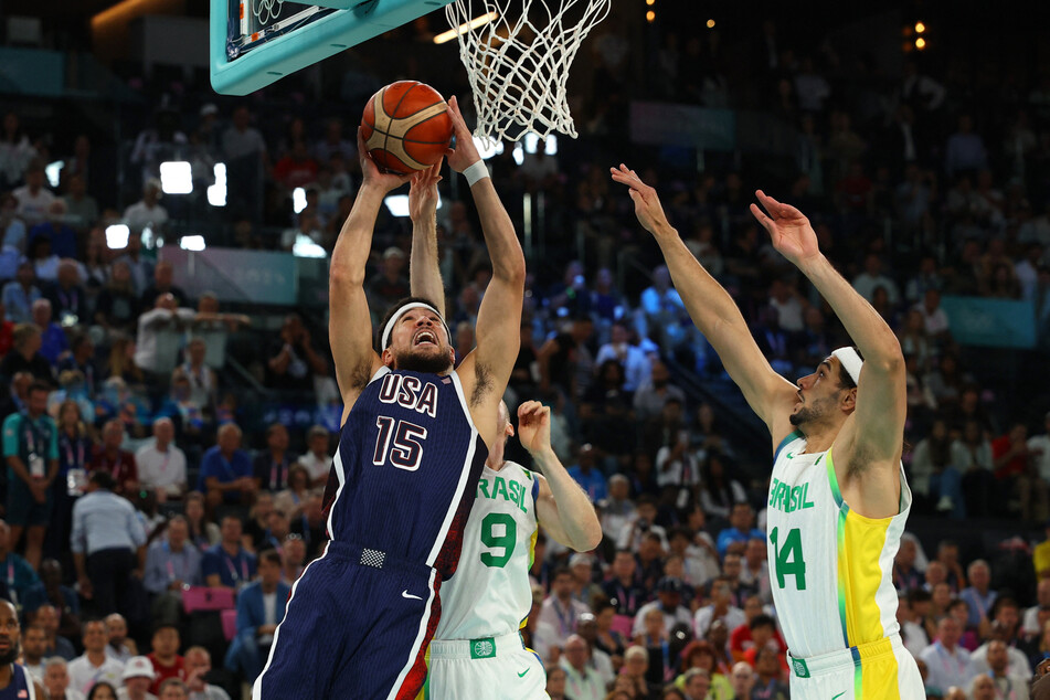 Devin Booker scored 18 points against Brazil as the US set up a semifinal against Serbia.