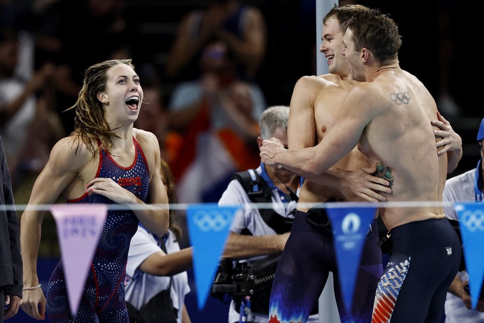 Team USA celebrates after winning gold in the Paris Olympics 4x100m mixed medley final.