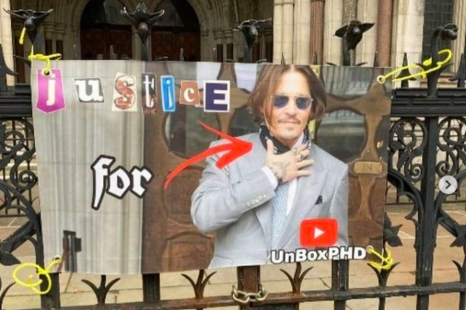 Fans made signs that rallied support of Depp outside the High Court in London this summer.