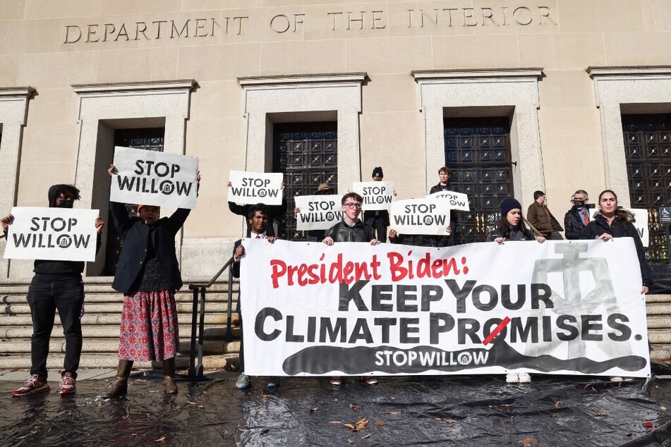 Protesters demonstrate in front of the US Department of the Interior demanding an end to the Willow oil-drilling project, approved by President Joe Biden in March 2023.