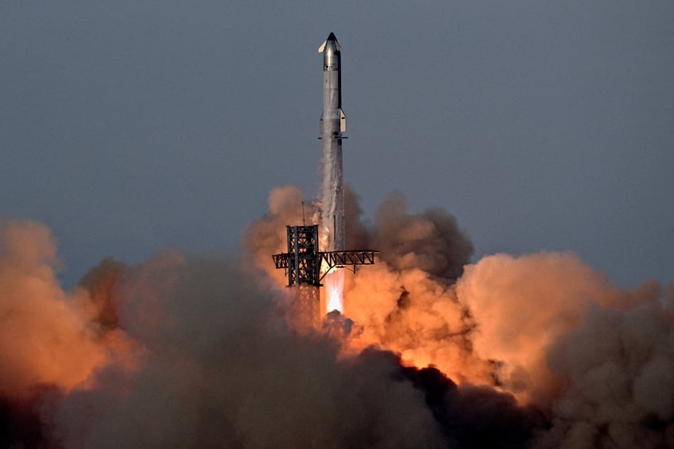 A SpaceX Super Heavy booster carrying the Starship spacecraft blasts off on its 10th test flight at the company's launch pad in Texas on August 26, 2025.